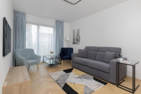 Warsaw Praga Okrzei Apartment by the River by Noclegi Renters